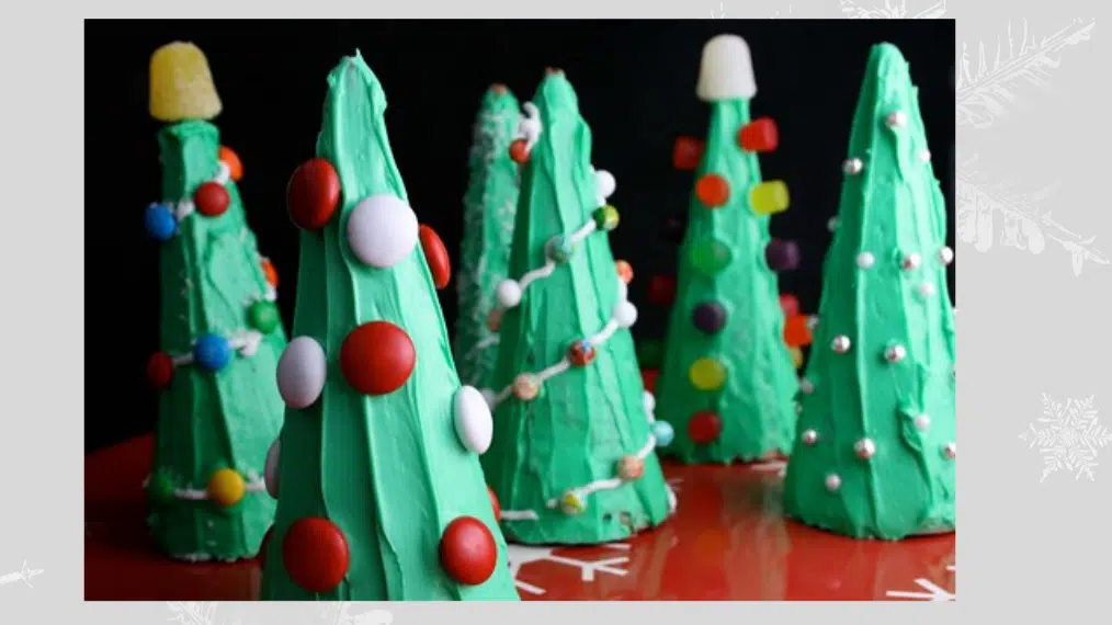 Edible Christmas trees decorated with frosting and candies.