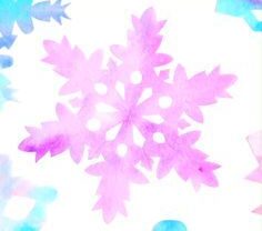 Large pink snowflake on blue and white background.
