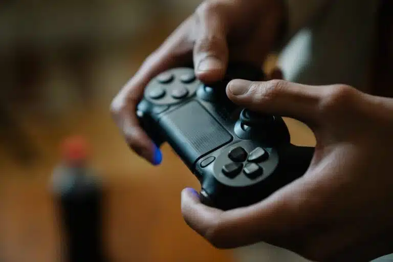 Hands holding a video game controller.